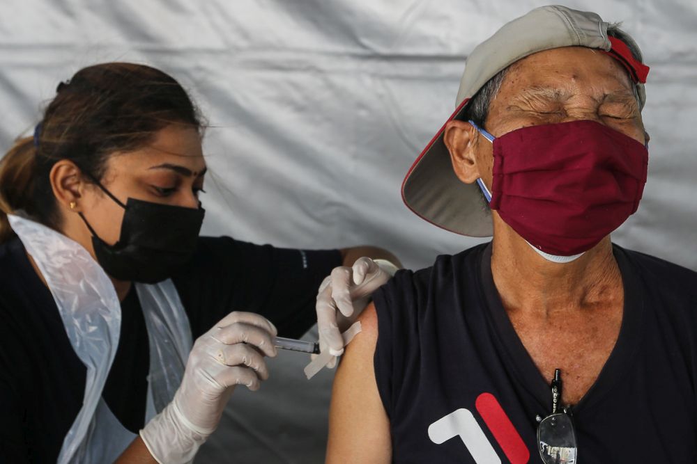 Members of the public receive their Covid-19 shot through the MYMedic@Wilayah Vaccine Mobile Truck programme at PPR Sg. Bonus in Setapak, Kuala Lumpur June 21, 2021. u00e2u20acu201d Picture by Yusof Mat Isa