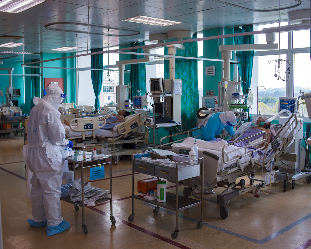 Health workers perform daily routines on Covid-19 patients who are intubated such as taking blood, administering medication and giving food. u00e2u20acu201d Picture by Shafwan Zaidon