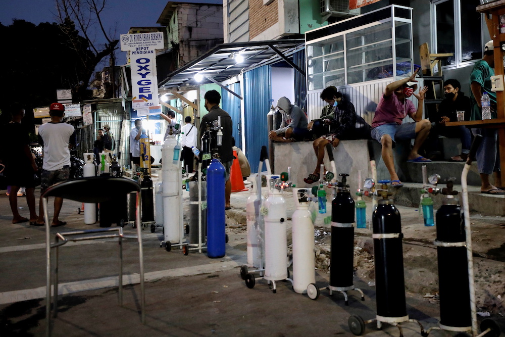 Oxygen tanks to be refilled are arranged in a line as Indonesia experiences an oxygen supply shortage amid a surge of coronavirus disease (Covid-19) cases, at a filling station in Jakarta, Indonesia, July 5, 2021. u00e2u20acu201d Reuters pic
