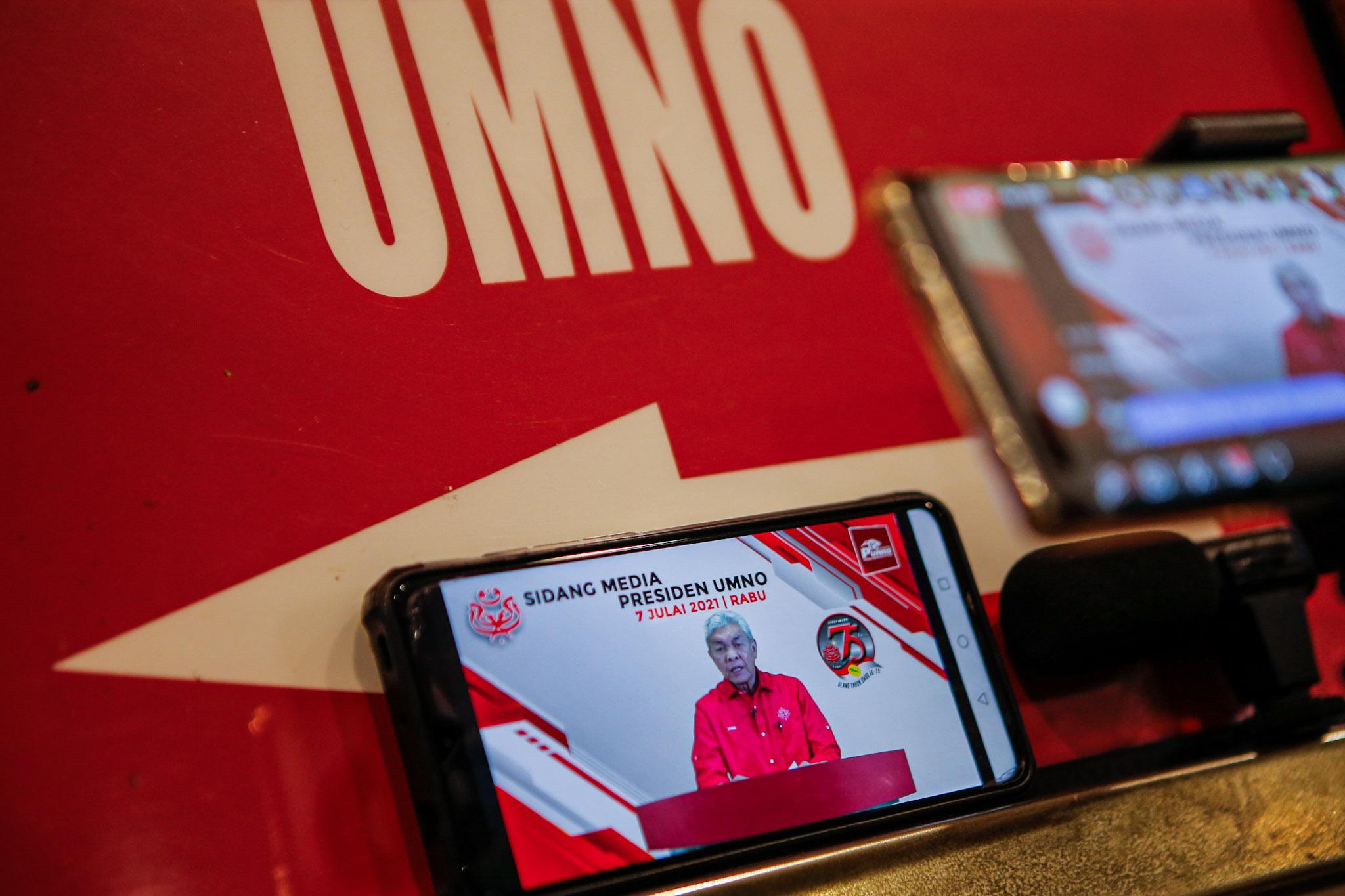 Members of the media watching a livestream of Umno president Datuk Seri Ahmad Zahid Hamidiu00e2u20acu2122s speech at Umno headquarters in Kuala Lumpur, July 7, 2021. u00e2u20acu201d Picture by Hari Anggara