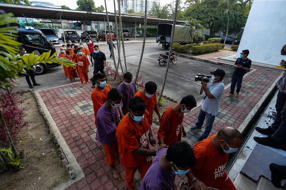 A group of men are led to the Bukit Mertajam Court to be remanded after a video clip of them performing Aidiladha prayers outside the Taman Pelangi Surau in Juru went viral on social media, July 21, 2021. u00e2u20acu201d Picture by Sayuti Zainudin