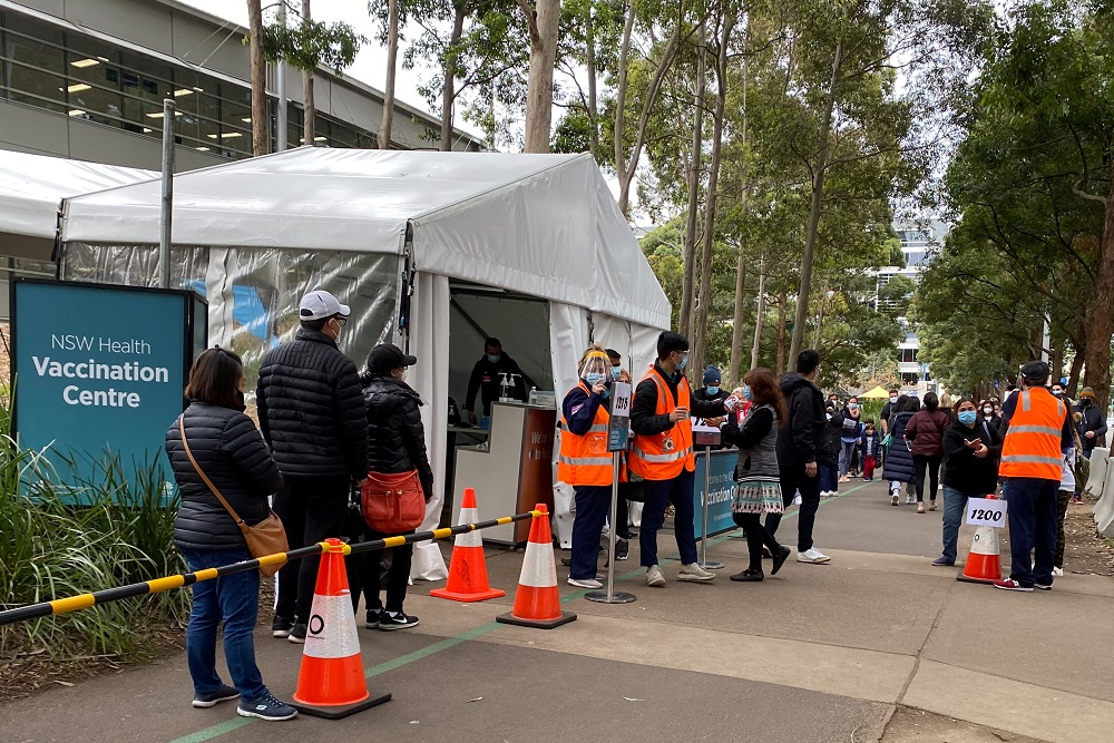 People wait in line outside a Covid-19 vaccination centre at Sydney Olympic Park in Sydney, Australia July 14, 2021. u00e2u20acu2022 Reuters pic