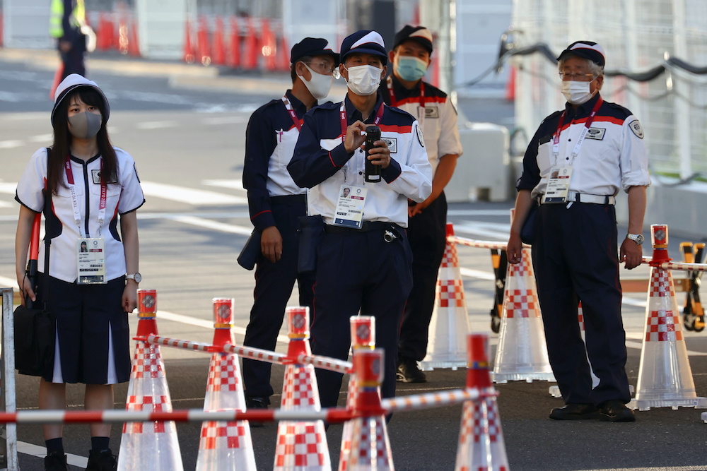 Security staff stand guard at the entrance of the Athletes Village, where a person has tested positive for Covid-19, ahead of Tokyo 2020 Olympic Games in Tokyo, Japan July 17, 2021. u00e2u20acu201d Reuters picnn