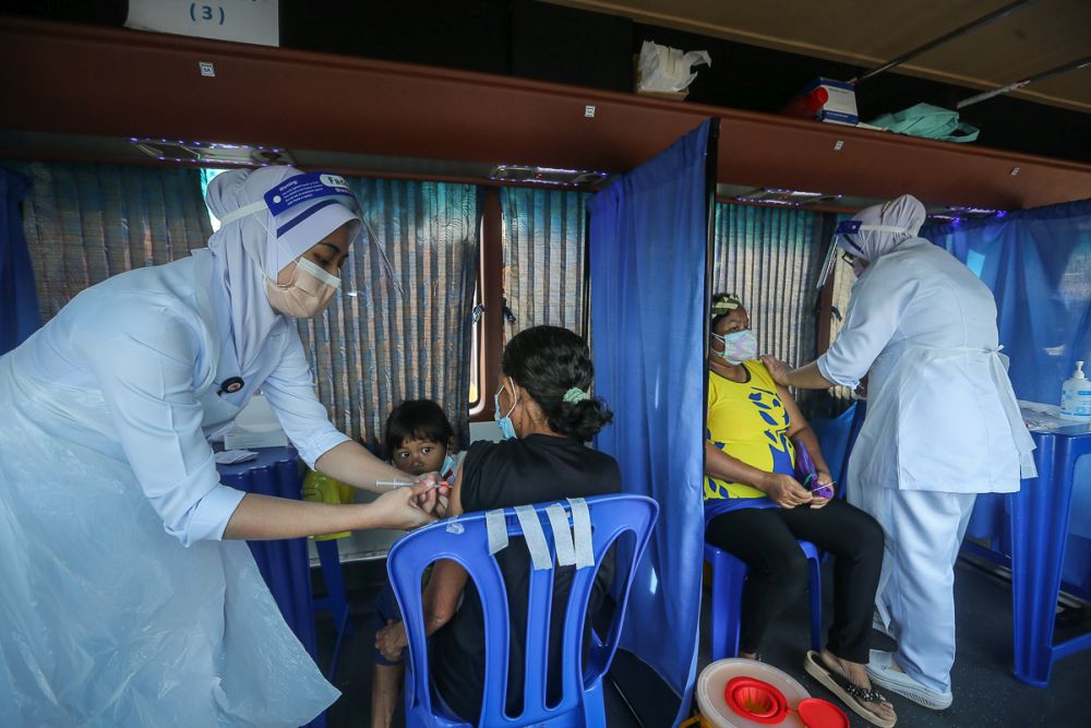 Orang Asli receive their Covid-19 jab in Jenjarom July 29, 2021. u00e2u20acu201d Picture by Yusof Mat Isa