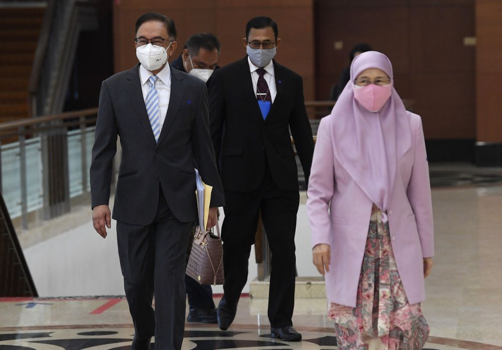 Opposition Leader Datuk Seri Anwar Ibrahim and his wife Datuk Seri Dr Wan Azizah Wan Ismail are pictured at Parliament, Kuala Lumpur July 29, 2021. u00e2u20acu201d Bernama pic