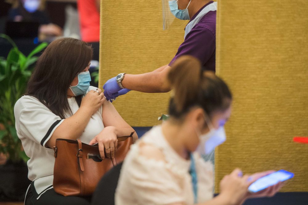 People receive their Covid-19 jabs at the Eastin Hotel in Petaling Jaya July 23, 2021. u00e2u20acu201d Picture by Shafwan Zaidon