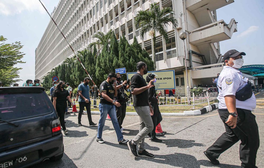 Doctors walk out of the Raja Permaisuri Bainun Hospital in support o f#HartalContractDoctors in Ipoh July 26, 2021. u00e2u20acu201d Picture by Farhan Najib