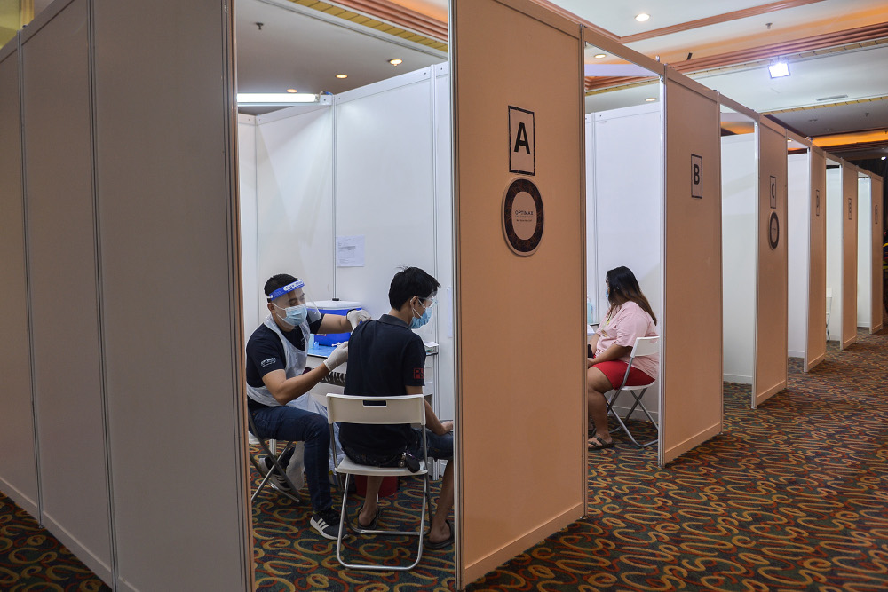 People taking the Covid-19 jab during the launch of the Prihatin vaccination service at Grand Seasons Hotel July 15, 2021. u00e2u20acu201d Picture by Miera Zulyana
