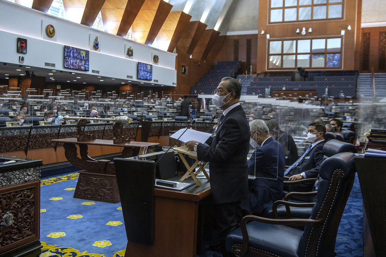 Prime Minister Tan Sri Muhyiddin Yassin delivers his statement on the National Recovery Plan during a special Parliament sitting in Kuala Lumpur July 26, 2021. u00e2u20acu201d Bernama pic