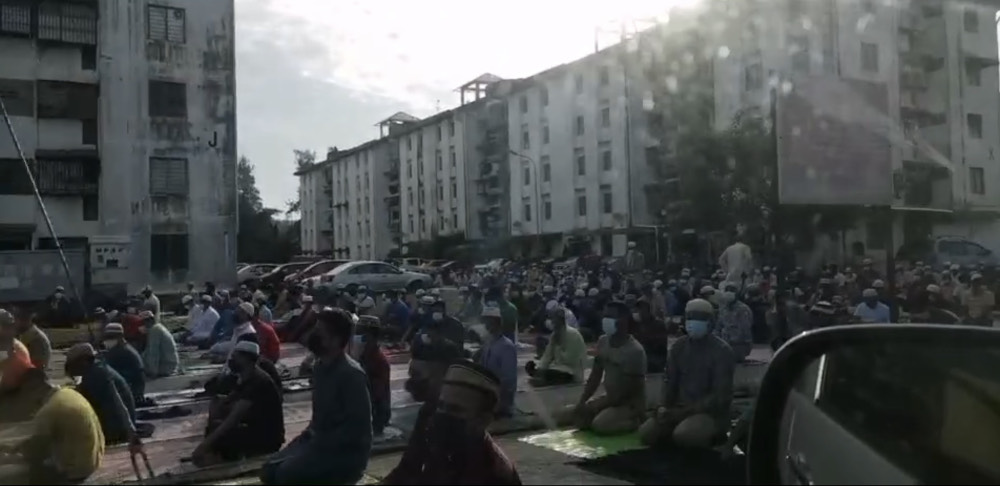 A crowd of around 200 people performing Aidiladha prayers outside a surau in Juru, Penang July 20, 2021. u00e2u20acu201d Video screencap from social media