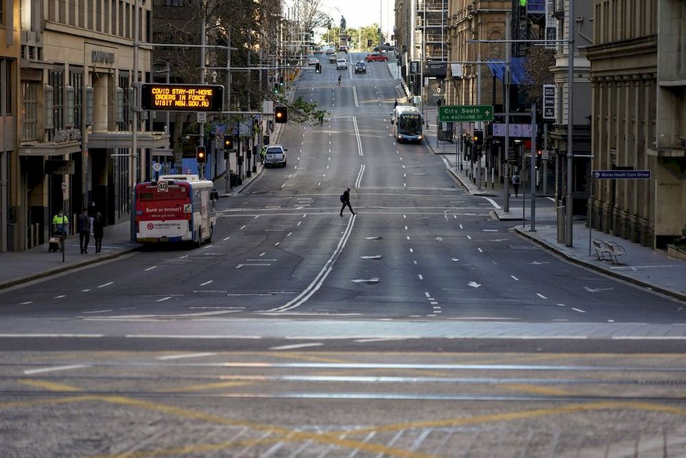A pedestrian crosses an unusually quiet street in the city centre during a lockdown to curb the spread of the coronavirus disease (Covid-19) in Sydney, Australia, July 5, 2021. u00e2u20acu201d Reuters pic
