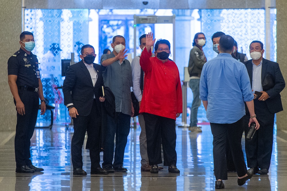 Former Federal Territories minister Datuk Seri Tengku Adnan Tengku Mansor waves as he leaves the Palace of Justice in Putrajaya July 16, 2021. u00e2u20acu2022 Picture by Shafwan Zaidon