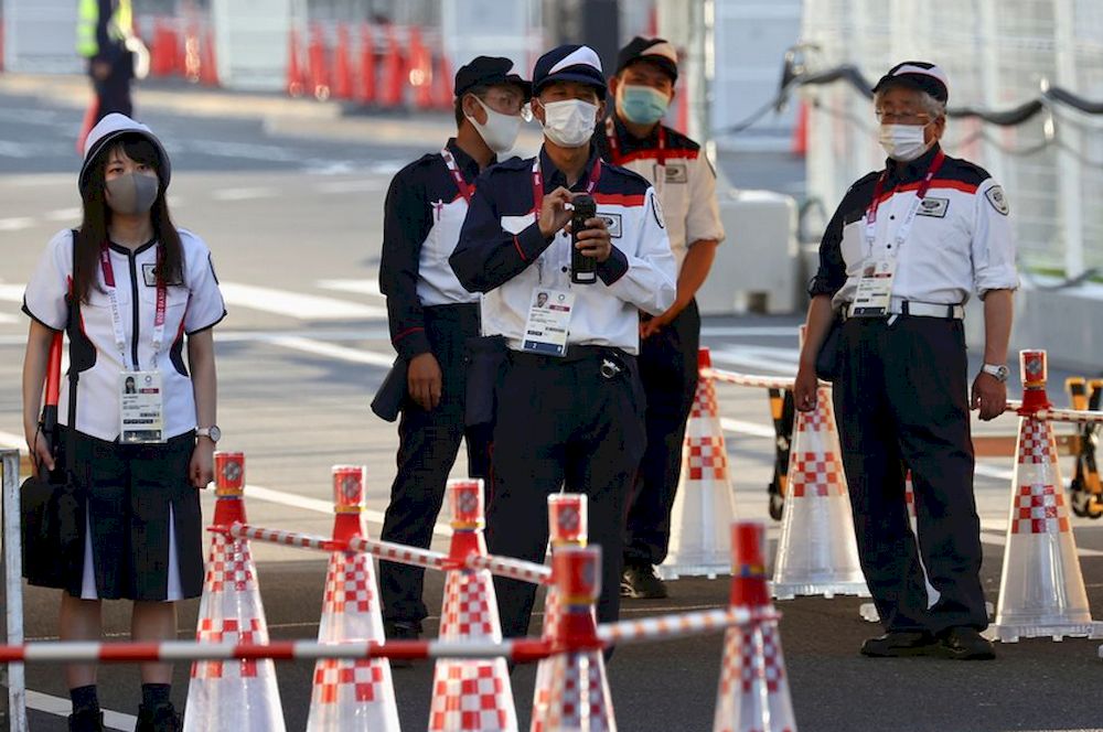 Security staff stand guard at the entrance of the Athletes Village, where a person has tested positive for Covid-19, ahead of Tokyo 2020 Olympic Games in Tokyo, Japan July 17, 2021. u00e2u20acu201d Reuters pic