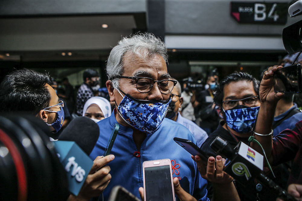 Bersatu supreme council member Datuk Seri Mohd Redzuan Md Yusof is seen leaving the Publika compound after a special meeting was held, August 15, 2021. u00e2u20acu2022 Picture by Hari Anggara