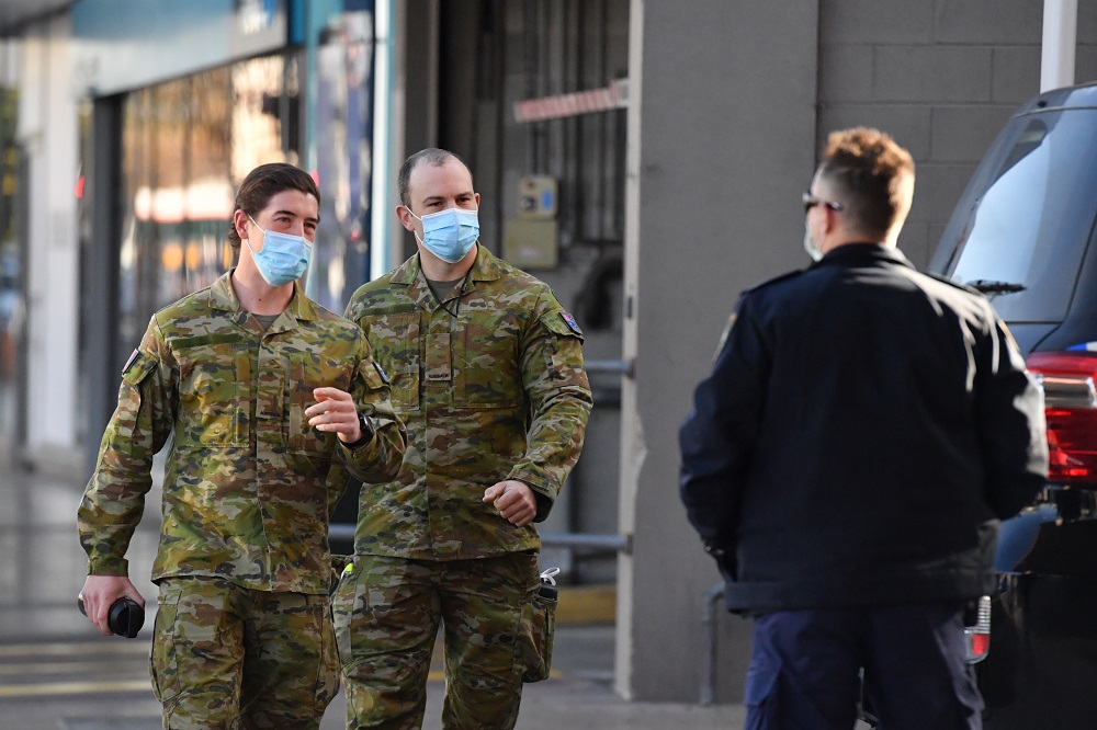 Australian Defence Force personnel and NSW police are seen at Fairfield in the south west suburb of Sydney August 2, 2021. u00e2u20acu201d AAP Image/Mick Tsikas via Reuters