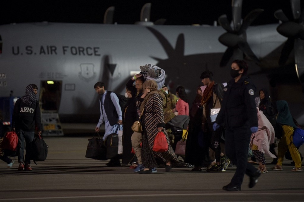 Afghan refugees, fleeing the Afghan capital Kabul, exit an US air force plane upon their arrival at Pristina International airport near Pristina August 29, 2021. u00e2u20acu201d AFP pic