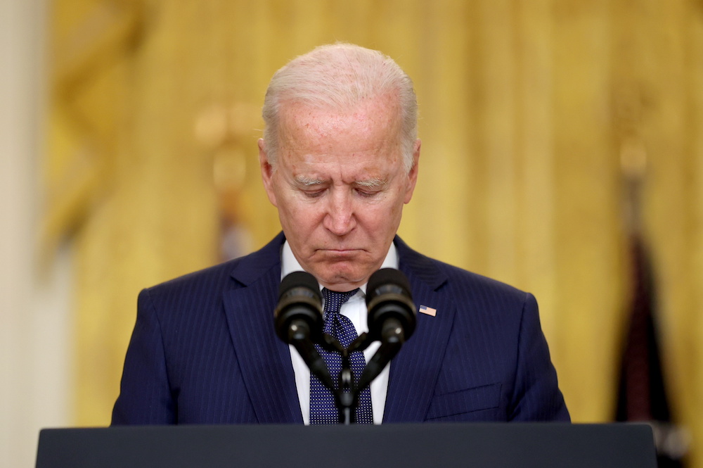 US President Joe Biden reacts during a moment of silence for the dead as he delivers remarks about Afghanistan, from the East Room of the White House in Washington August 26, 2021. u00e2u20acu201d Reuters pic