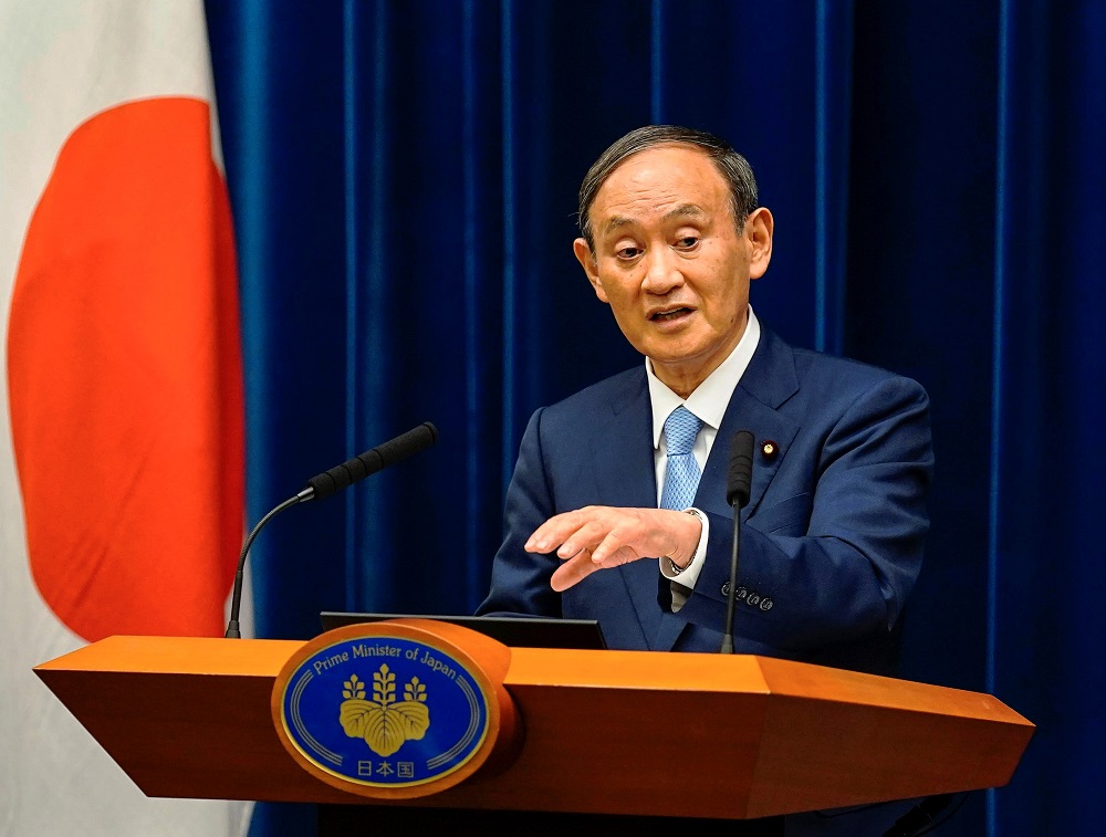 Japanese Prime Minister Yoshihide Suga speaks during a news conference announcing to extend a state of emergency on Covid-19 pandemic at his official residence in Tokyo August 17, 2021. u00e2u20acu2022 Kimimasa Mayama/Pool via Reuters