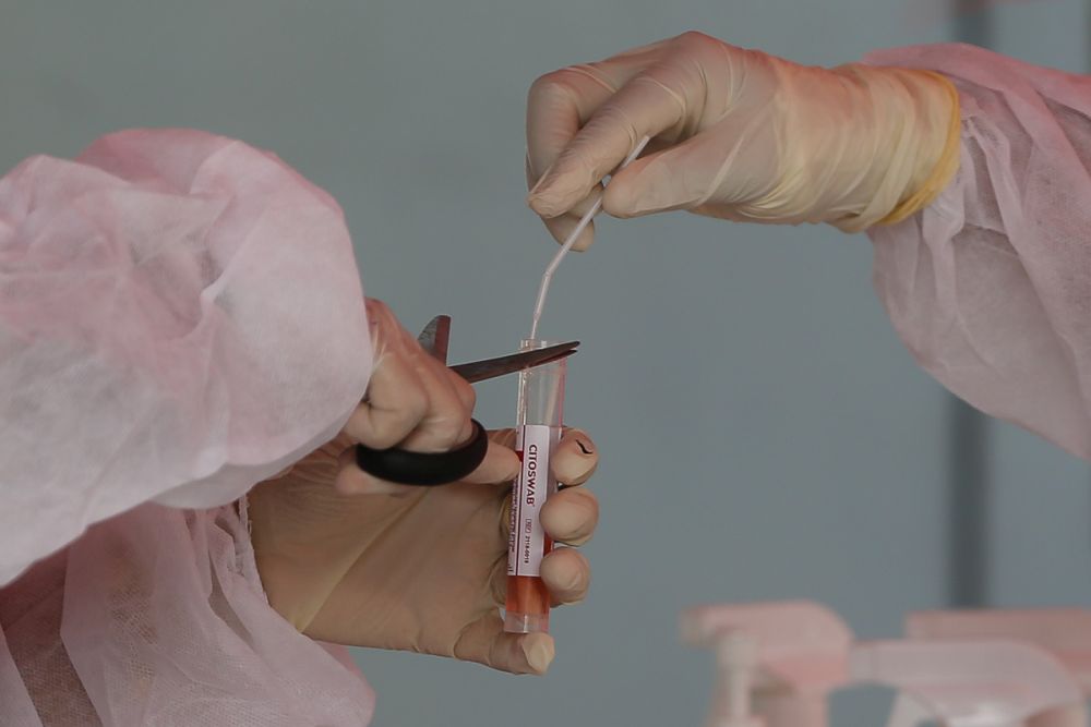 Health workers collect swab samples to test for Covid-19 at the Selcare Clinic in Shah Alam August 1, 2021. u00e2u20acu201d Picture by Yusof Mat Isa