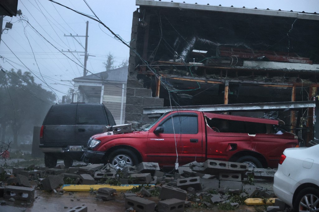 Vehicles are damaged after the front of a building collapsed during Hurricane Ida on August 29, 2021 in New Orleans, Louisiana. u00e2u20acu201d Scott Olson/Getty Images/AFP pic