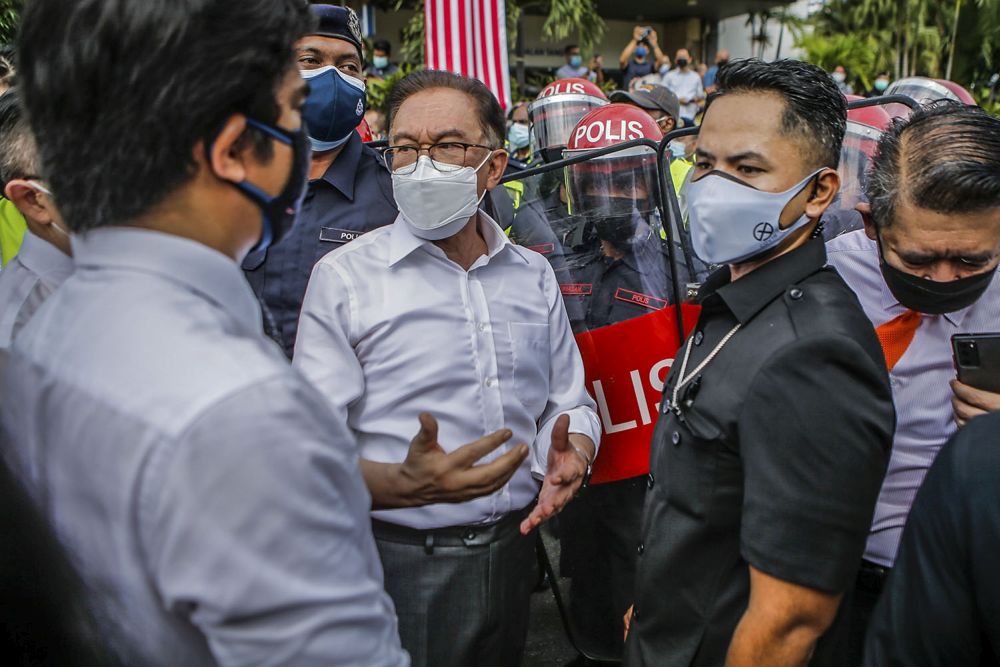 Port Dickson MP Datuk Seri Anwar Ibrahim is pictured as Federal Reserve Unit personnel halt Opposition MPs' march to the Parliament building in Kuala Lumpur August 2, 2021. u00e2u20acu201d Picture by Hari Anggara