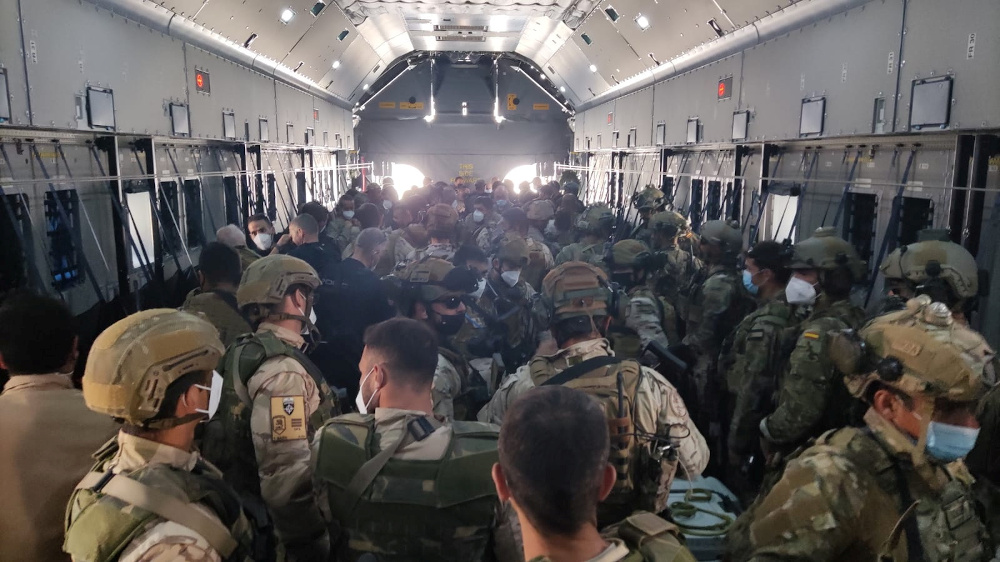 Afghan collaborators, their families, Spanish soldiers and members of the embassy board a Spanish military plane as part of their evacuation, at the Hamid Karzai International Airport in Kabul August 27, 2021. u00e2u20acu201d Ministry of Defence of Spain pic via Reut