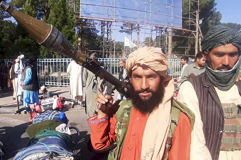 In this picture taken on August 13, 2021, a Taliban fighter holds a rocket-propelled grenade (RPG) along the roadside in Herat, Afghanistanu00e2u20acu2122s third biggest city, after government forces pulled out the day before following weeks of being under siege. u00e2u20acu201d