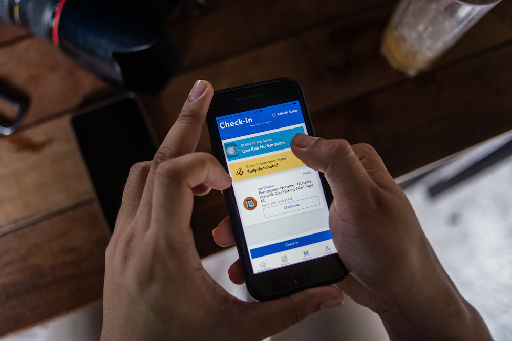 The MySejahtera app has been updated to make it easier for people to display their risk level and vaccination status. u00e2u20acu201d Picture by Shafwan Zaidon