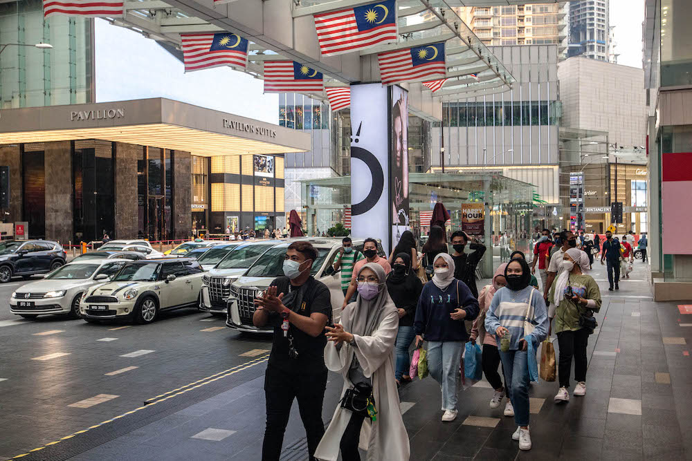People are seen wearing protective masks as they walk along the Bukit Bintang shopping area during Phase One of the National Recovery Plan in Kuala Lumpur on September 4, 2021. u00e2u20acu201d Picture by Firdaus Latifnn