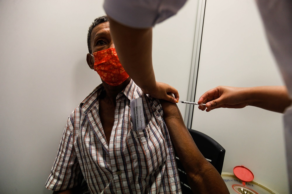 A man receives his Covid-19 vaccine jab at the Vaccine Administration Centre in Sungai Nibong Expo Site Sept 8, 2021. u00e2u20acu2022 Picture by Sayuti Zainudin