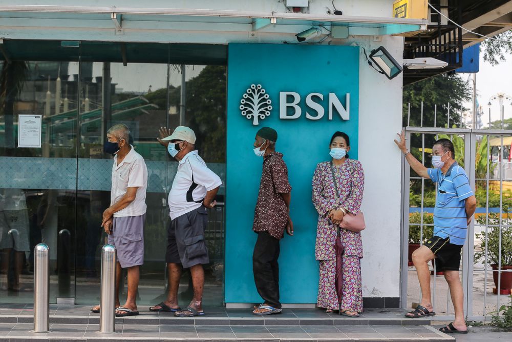 People queue in front of a Bank Simpanan Nasional branch in Klang September 6, 2021. u00e2u20acu201d Picture by Yusof Mat Isa