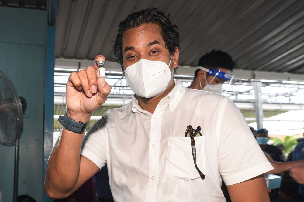 Health Minister Khairy Jamaluddin holds up a dose of the CanSino Covid-19 vaccine during a working visit to Pulau Larapan, Semporna September 7, 2021. u00e2u20acu2022 Bernama pic