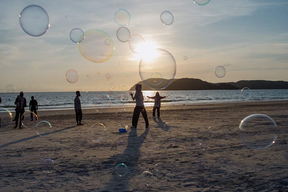 People are seen spending their leisure time at Pantai Cenang in Langkawi September 17, 2021. u00e2u20acu2022 Picture by Shafwan Zaidon