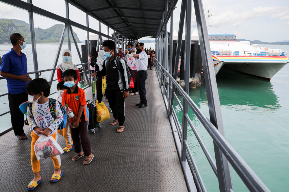 Tourists arrive at the jetty, as Langkawi reopens to domestic tourists, amid the coronavirus disease (Covid-19) pandemic, in Malaysia September 16, 2021. u00e2u20acu201d Reuters pic 