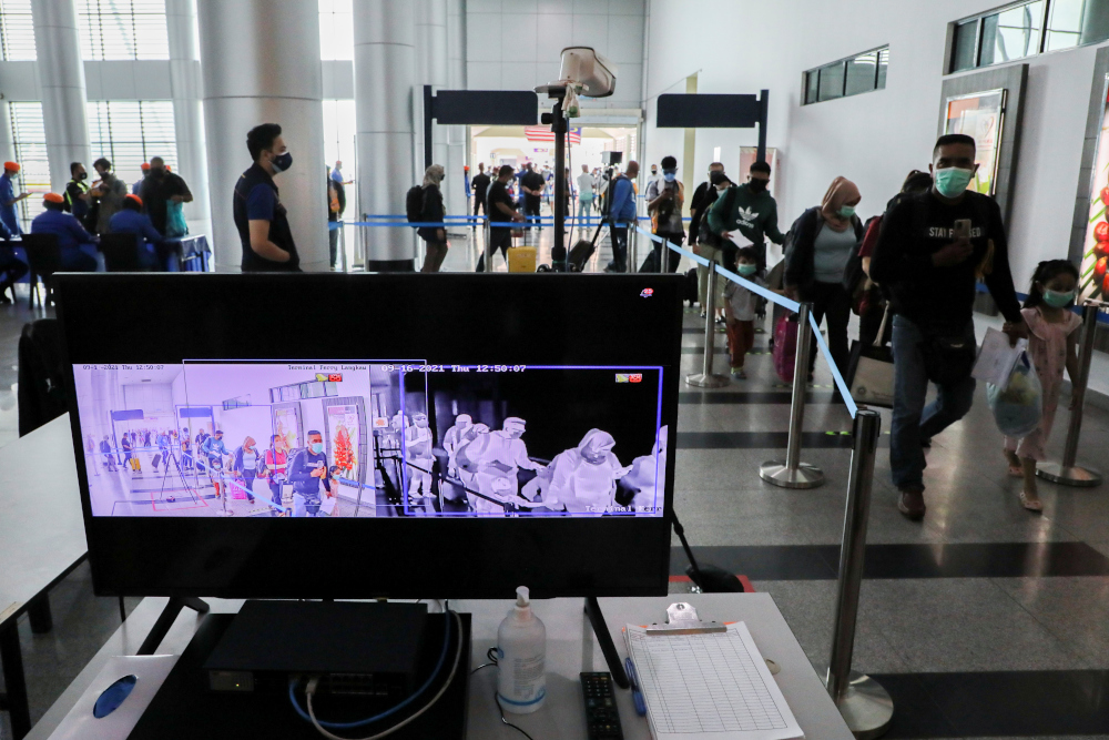 Tourists walk past a thermal scanner at the jetty, as Langkawi reopens to domestic tourists, amid the coronavirus disease (Covid-19) pandemic, in Malaysia September 16, 2021. u00e2u20acu201d Reuters pic 