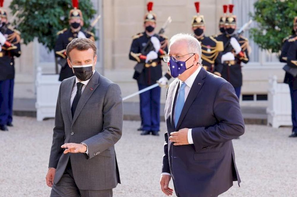 French President Emmanuel Macron and Australian Prime Minister Scott Morrison walk in front of the Elysee Palace in Paris, France, June 15, 2021. u00e2u20acu201d Reuters pic