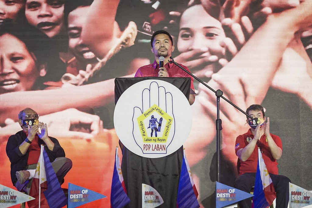 This handout photo taken on September 19, 2021, shows Philippine boxer-turned-politician Manny Pacquiao (centre) speaking during the PDP-Laban national assembly in Manila. u00e2u20acu201d Office of Philippine Senator Koko Pimentel / AFP pic