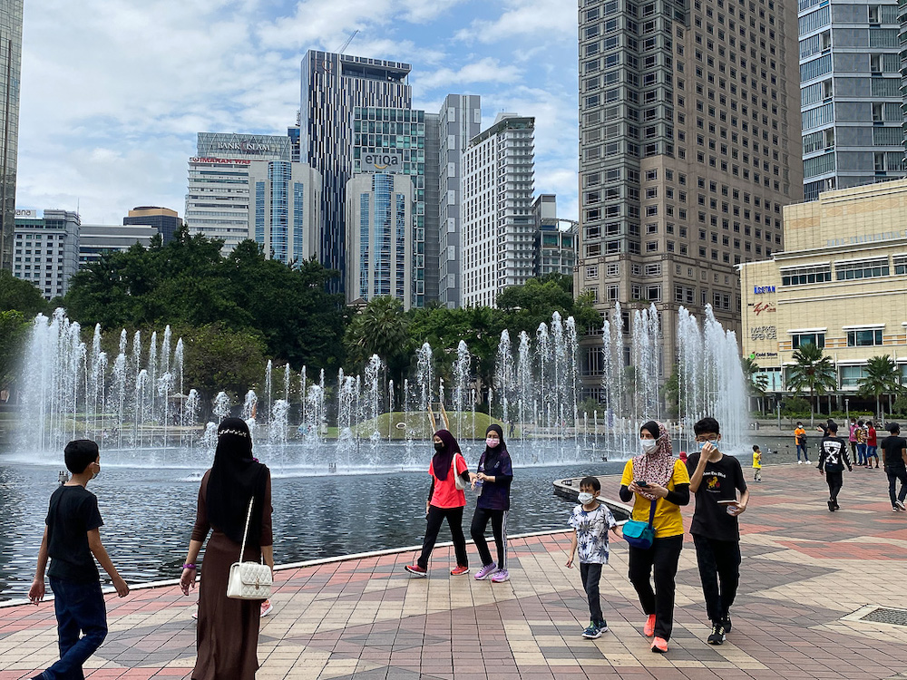 People spend the afternoon at KLCC Park in Kuala Lumpur October 10, 2021. u00e2u20acu201d Picture by Yusof Mat Isa