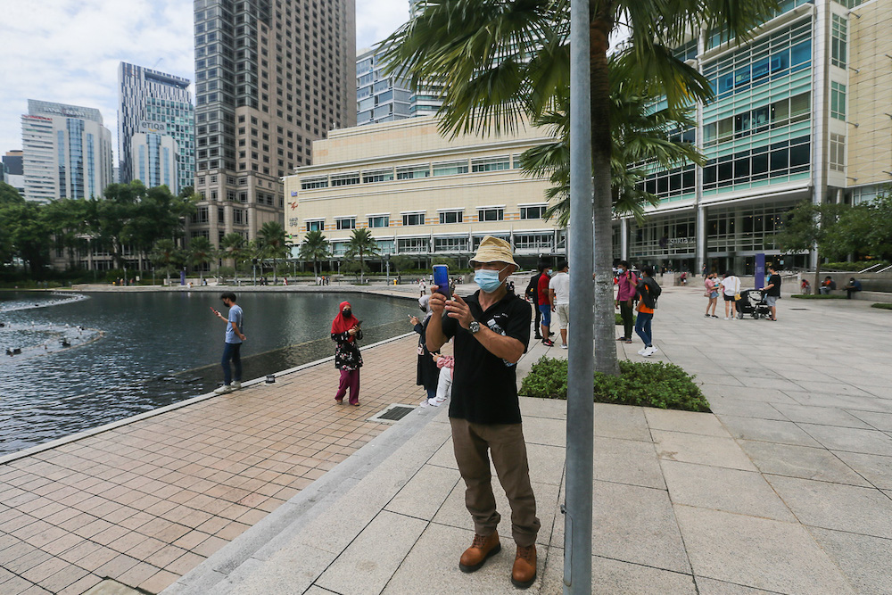 People spend the afternoon at KLCC Park in Kuala Lumpur October 10, 2021. u00e2u20acu201d Picture by Yusof Mat Isa