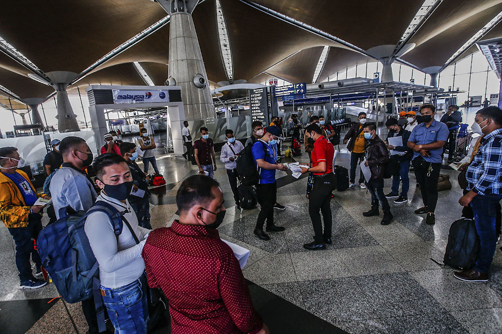 Travellers are seen with their luggage at the Kuala Lumpur International Airport after the government gave permission for fully-vaccinated Malaysians to travel abroad October 17, 2021. u00e2u20acu2022 Picture by Hari Anggara