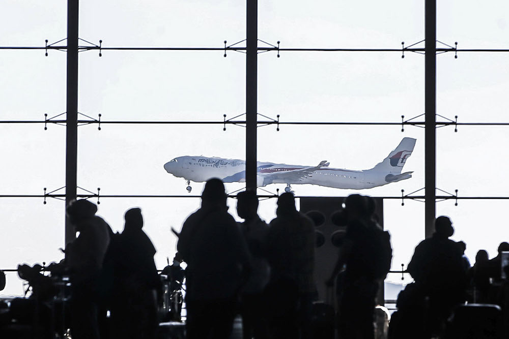 A plane takes off at the Kuala Lumpur International Airport after the government gave permission for fully-vaccinated Malaysians to travel abroad October 17, 2021. u00e2u20acu2022 Picture by Hari Anggara