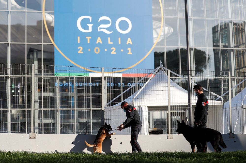 Carabinieri police officers inspect the area with explosive detection dogs outside the convention centre u00e2u20acu02dcLa Nuvolau00e2u20acu2122 (the cloud) ahead of the G20 summit in Rome, Italy October 27, 2021. u00e2u20acu2022 Reuters pic