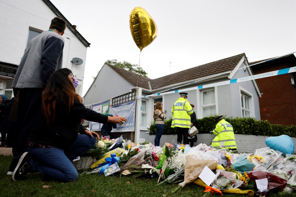 Well-wishers lay floral tributes at the scene of the fatal stabbing of Conservative British lawmaker David Amess, at Belfairs Methodist Church in Leigh-on-Sea, a district of Southend-on-Sea, in southeast England on October 16, 2021. u00e2u20acu201d AFP pic