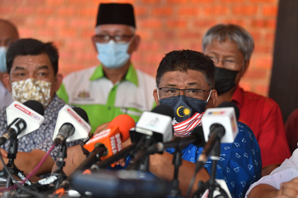 Melaka Umno chairman Datuk Seri Ab Rauf Yusoh (front right) speaks during a press conference in Melaka October 4, 2021. u00e2u20acu201d Bernama pic