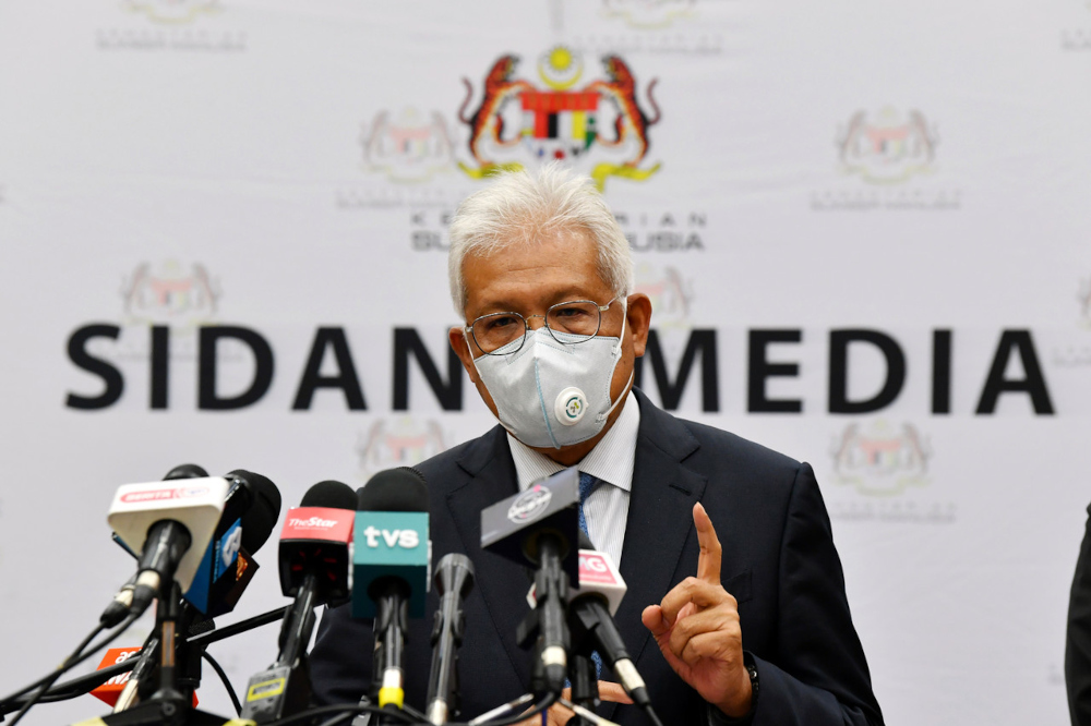 Home Minister Datuk Seri Hamzah Zainudin speaks to the media after a meeting on foreign workers with the Human Resources Ministry in Putrajaya, October 26, 2021. u00e2u20acu201d Bernama pic 