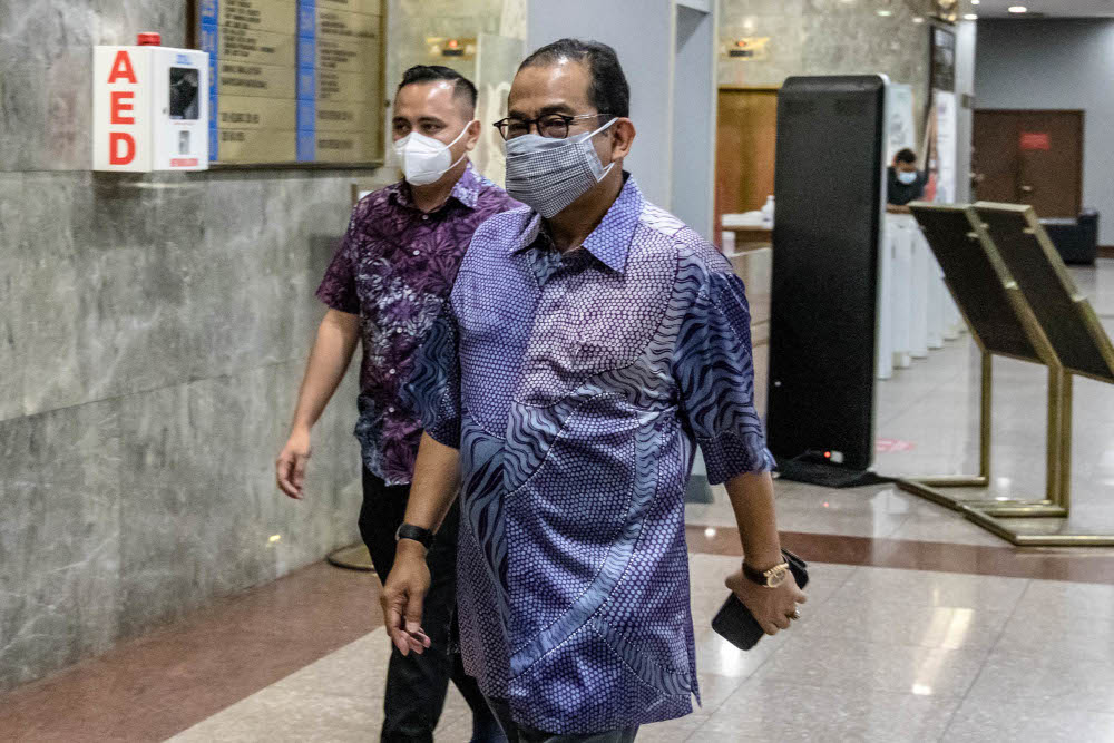 Umno vice-president Datuk Seri Mohamed Khaled Nordin arrives for the Umno supreme council meeting at the Umno headquarters in Kuala Lumpur, October 14, 2021. u00e2u20acu201d Picture by Firdaus Latif