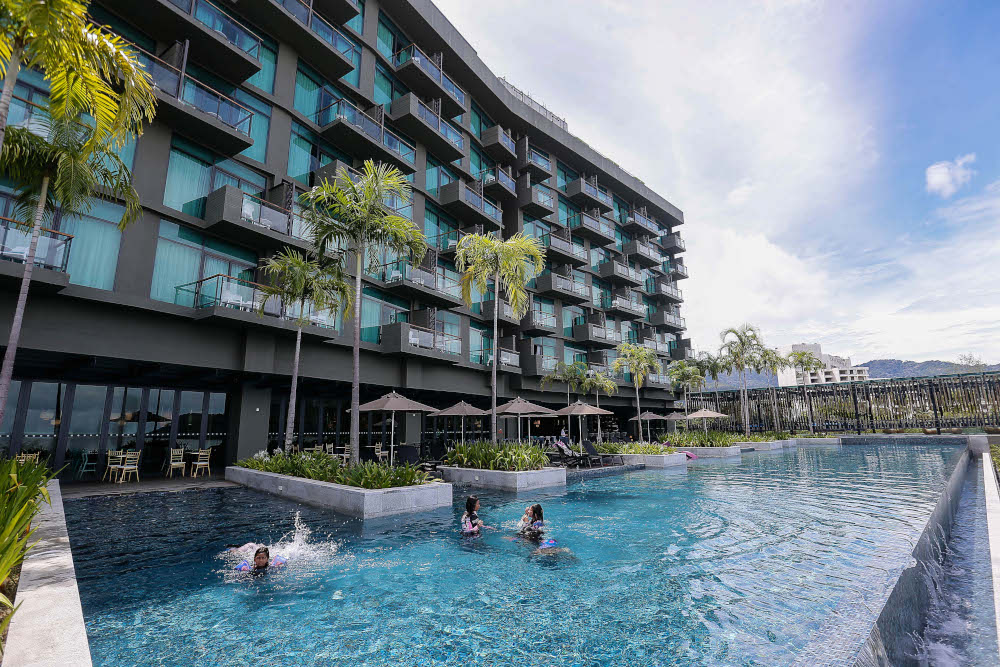 Tourists pictured taking a swim to cool down on a sunny day at a hotel in Teluk Bahang, October 26, 2021. u00e2u20acu201d Picture by Sayuti Zainudin