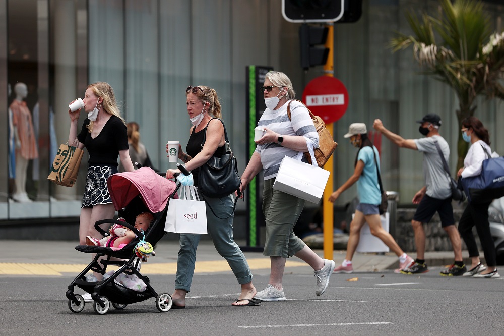 Shoppers walk through a retail district in the wake of coronavirus disease lockdown restrictions being eased in Auckland, New Zealand November 10, 2021. u00e2u20acu201d Reuters pic