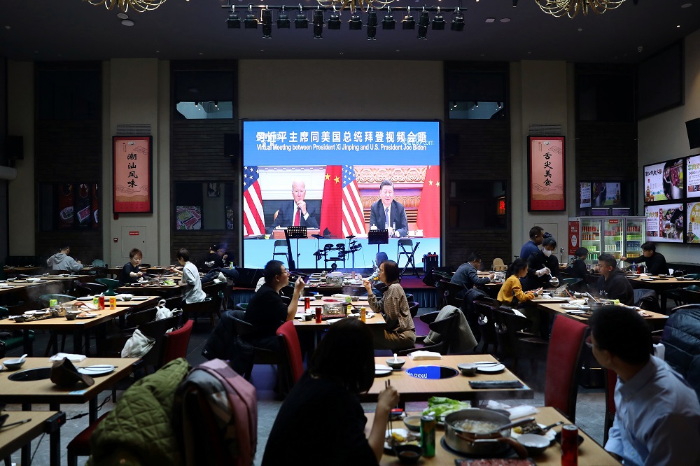 A screen shows Chinese President Xi Jinping attending a virtual meeting with US President Joe Biden via video link, at a restaurant in Beijing November 16, 2021. u00e2u20acu201d Reuters pic