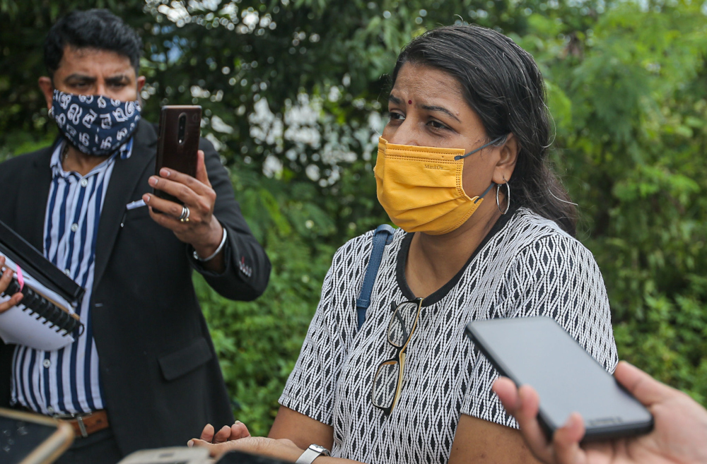 M. Indira Gandhi with Indira Gandhi Action Team (Ingat) chairman Arun Dorasamy speaking to the press at the Ipoh police district headquarters, November 18, 2021. u00e2u20acu201d Picture by Farhan Najib